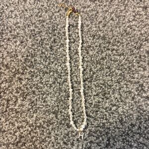 Elegant Pearl Necklace with “H” initial and Gold Accents